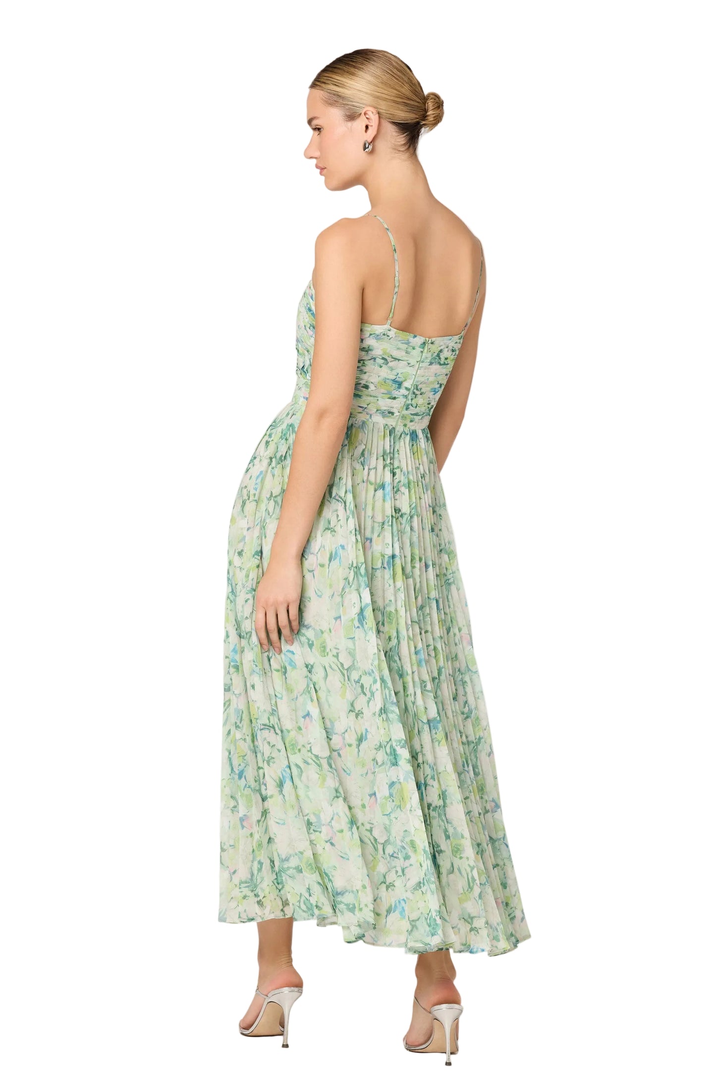 Woman wearing a floral dress on a white background