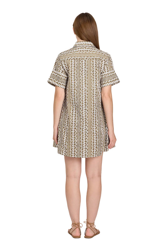 Woman wearing a patterned dress on a white background