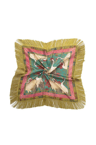 A square scarf with a crane and floral motif on light grey fabric, featuring decorative borders and fringe edges.