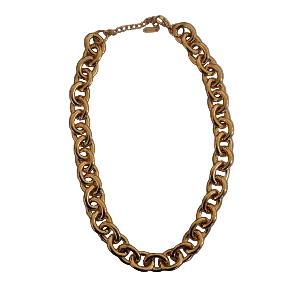 Gold chain necklace on a marble surface