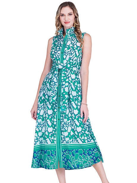 Woman wearing a green and blue patterned dress on a white background