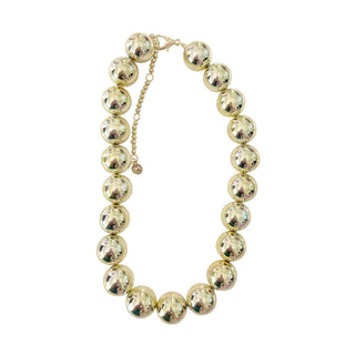 Gold beaded necklace with large, shiny beads and an adjustable chain.