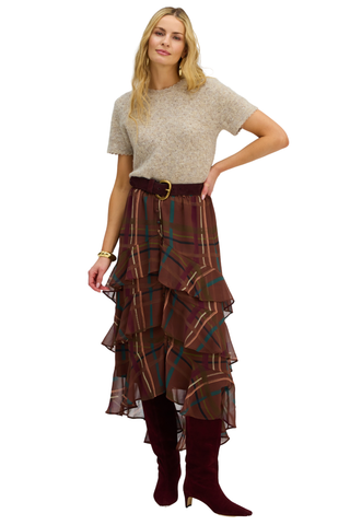 A light grey sweater with a pointelle pattern, short sleeves, and a loose fit, worn by a model with a plaid skirt.