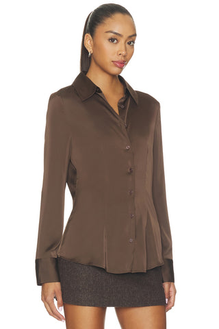 Chestnut faux leather crop top with a tailored fit, V-neck, and 3/4 sleeves.