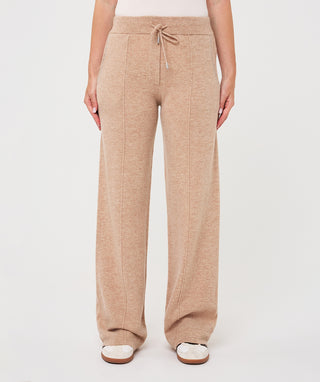 Knit trousers in sand color with a relaxed fit and ribbed waistband.