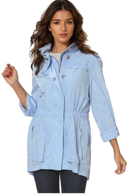 Woman wearing a light blue jacket on a white background