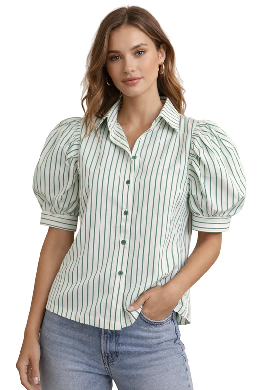 Woman wearing a green and white striped shirt with puffed sleeves on a beige background