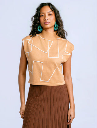 Sleeveless mock-neck sweater in chestnut with bold contrast piping in a geometric design.