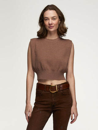 Sleeveless mocha crew neck sweater with structured armholes worn by a model.