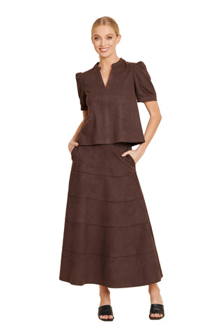 Faux suede paneled midi skirt in desert color with an A-line silhouette and high waist.