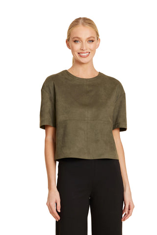 Model wearing a olive faux suede crop tee with a boxy fit and crew neckline.