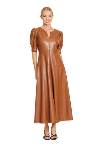 A faux leather shirt dress in chestnut with a split V-neckline and puff sleeves.